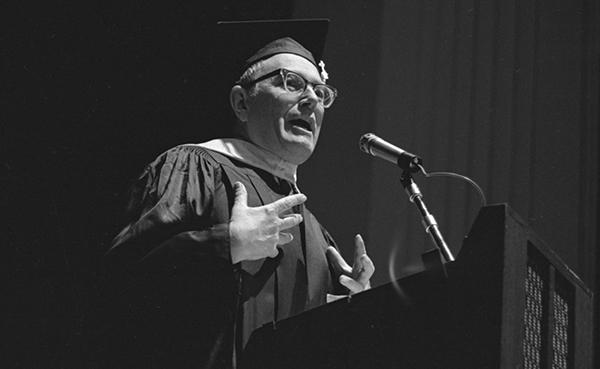 man speaking at graduation